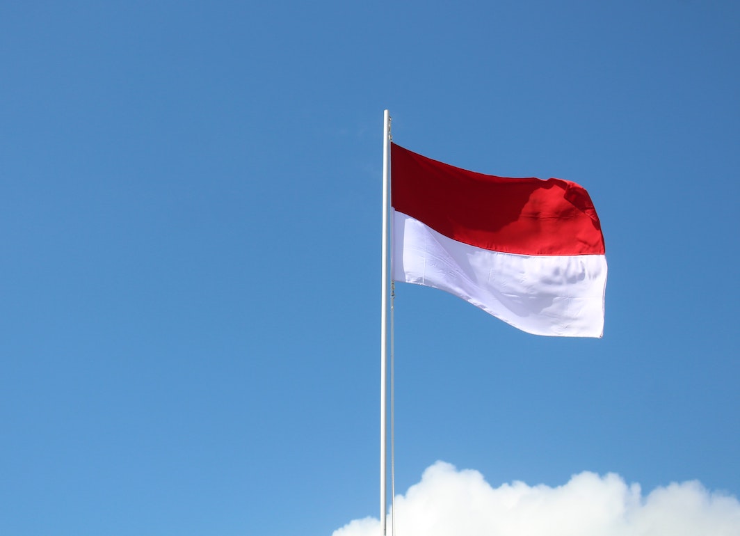 Flag of Indonesia against blue sky
