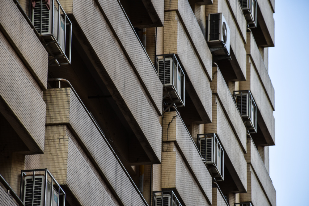 ACs installed on balconies of an apartment building