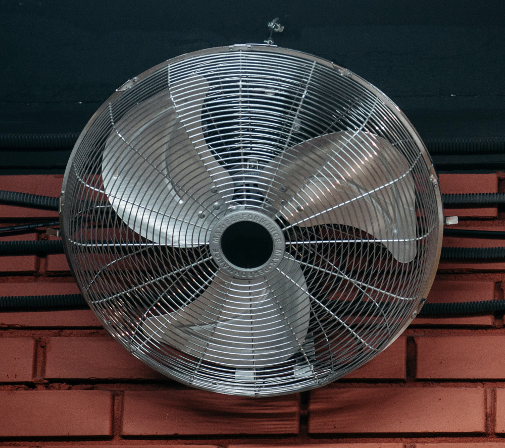 Fan cooling a room