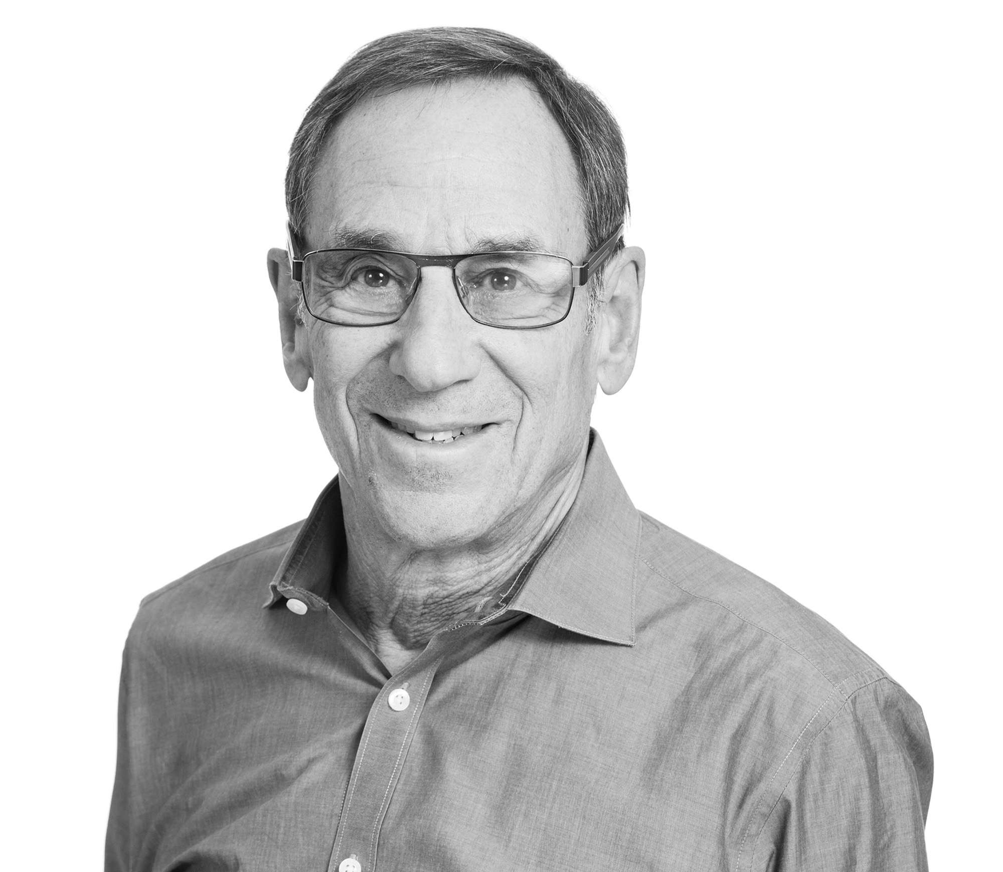 Image of smiling man in glasses