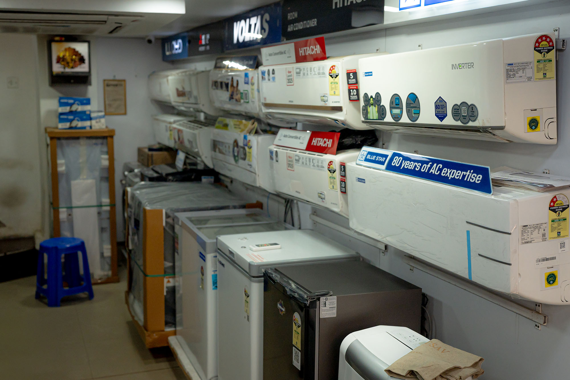 Interior view of stores with rows of air conditioners.